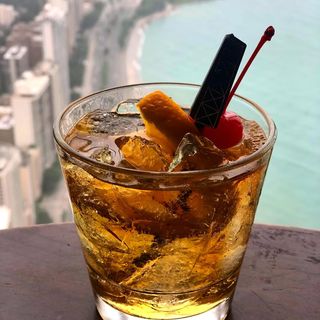 A cocktail garnished with mint